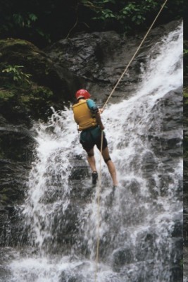 rappelling down the waterfall