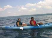 two people; one paddler